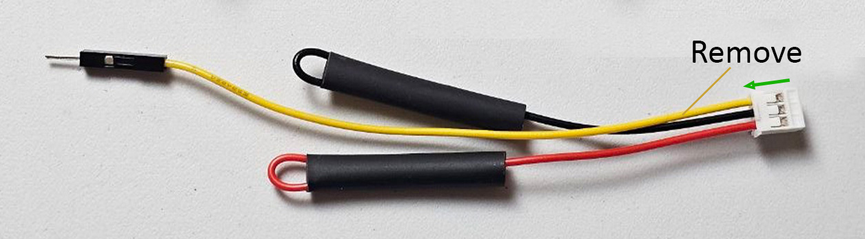 Close-up of the three-pin Sensors AD housing with the AD contact marked for removal